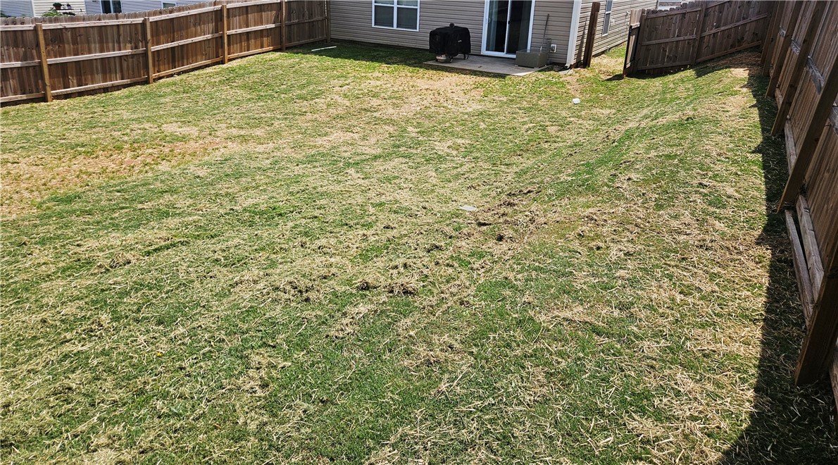 902 Ashwood Lane Easley, SC 29640 - Photo 6 of 39 Secure yard featuring a durable wood fence, offering private outdoor leisure space.