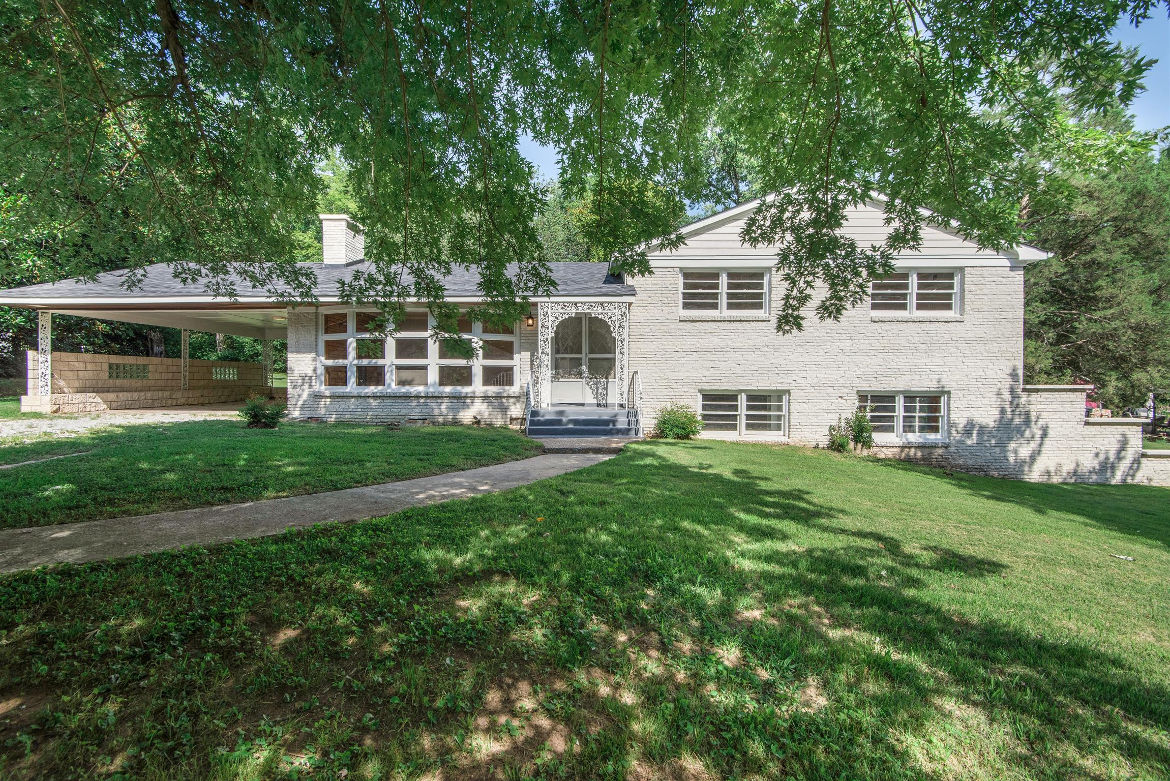 110 Dabney Drive Franklin, TN 37064 - Photo 1 of 25 a view of a house with a yard and sitting area