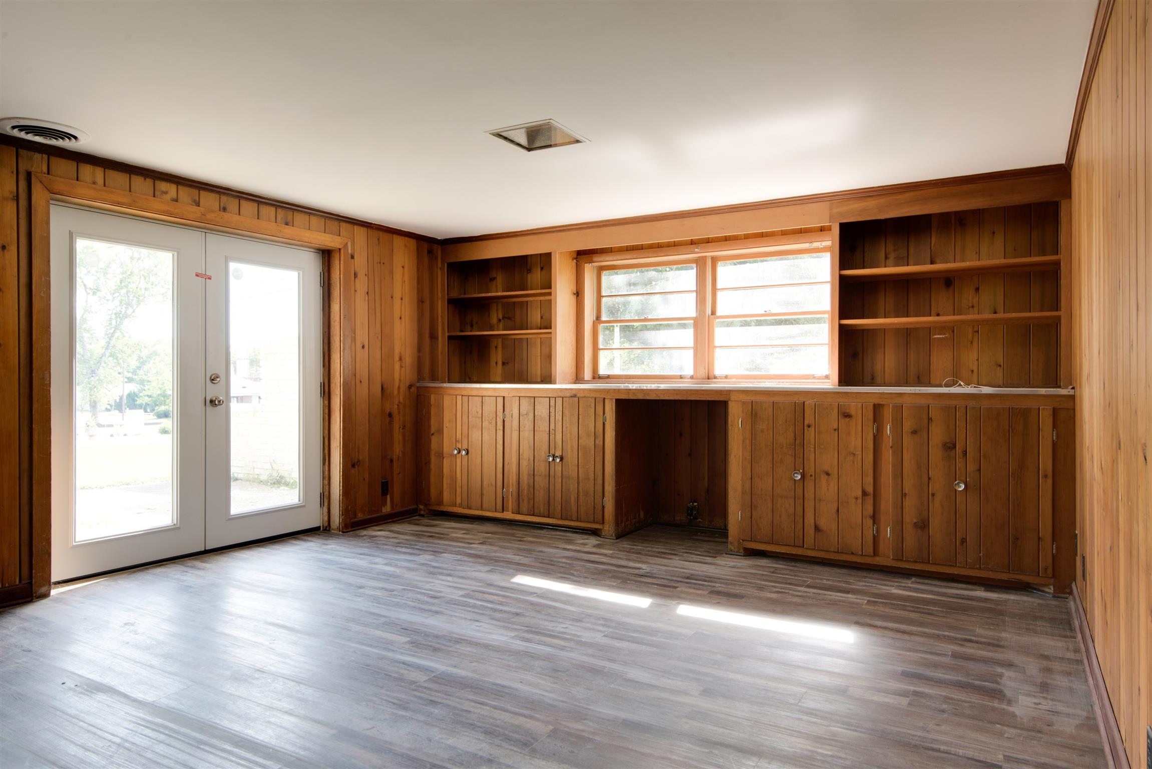 110 Dabney Drive Franklin, TN 37064 - Photo 17 of 25 an empty room with wooden floor and windows