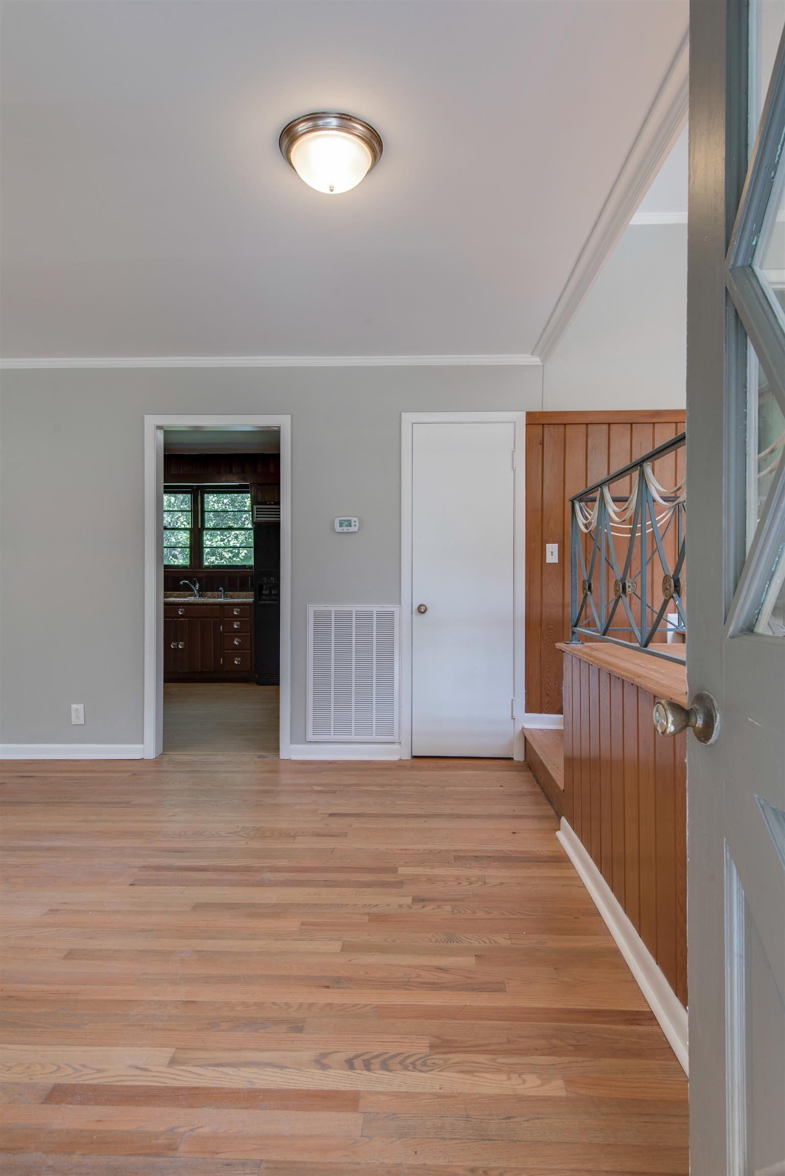 110 Dabney Drive Franklin, TN 37064 - Photo 3 of 25 a view of a hallway with wooden floor and entryway