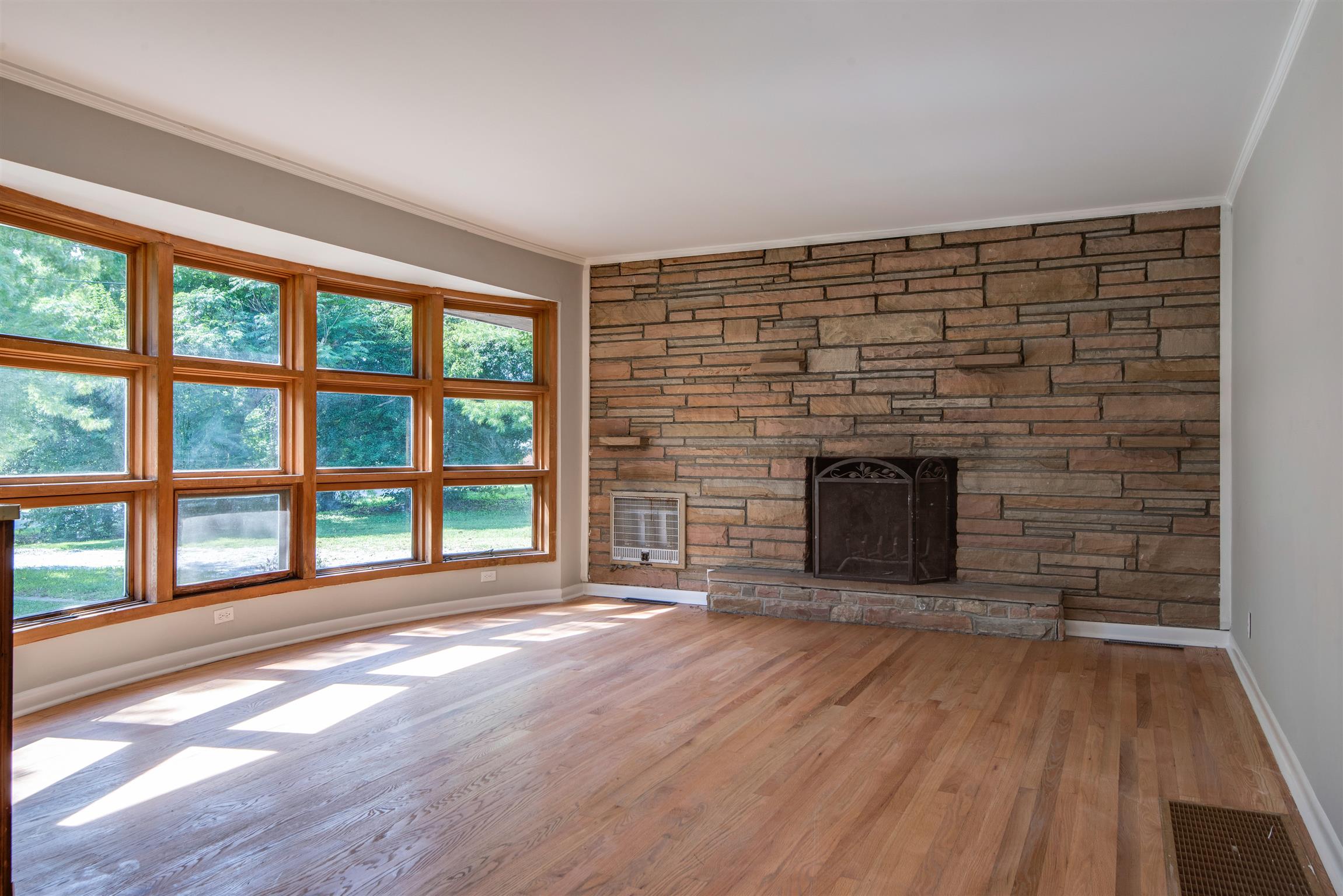 110 Dabney Drive Franklin, TN 37064 - Photo 4 of 25 wooden floor fireplace and windows in an empty room