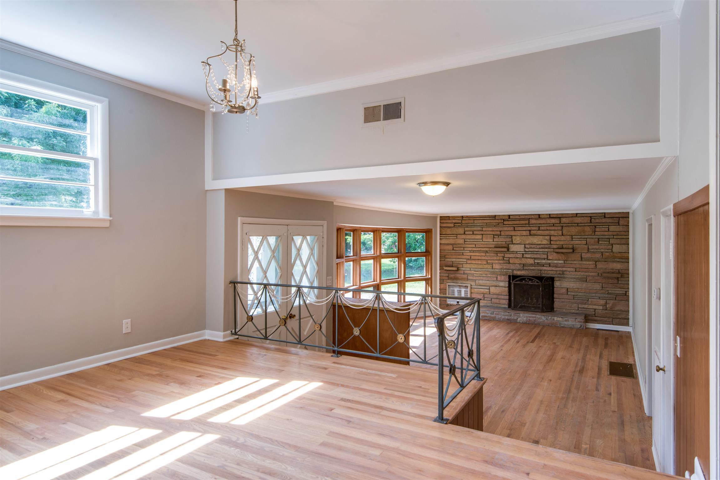 110 Dabney Drive Franklin, TN 37064 - Photo 5 of 25 a view of a livingroom with wooden floor and a fireplace