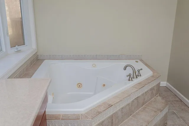 a view of a house with wooden deck