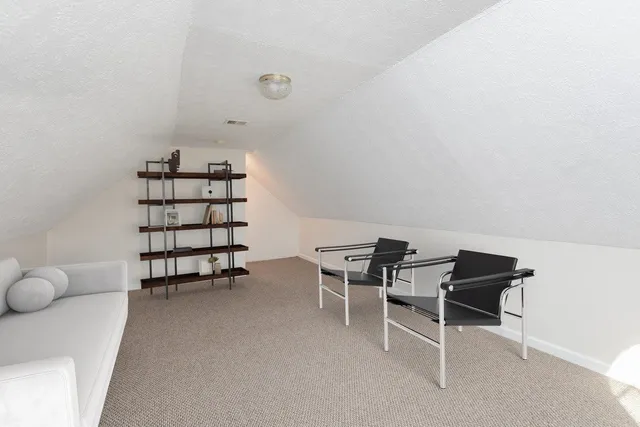 a view of a house with trees in the background