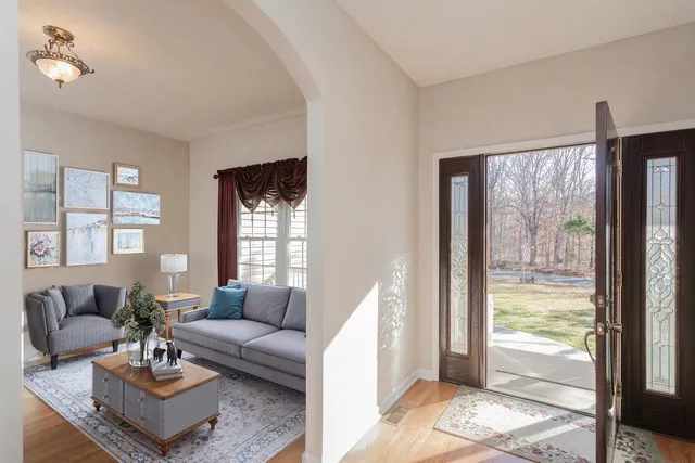 a living room with furniture and a rug