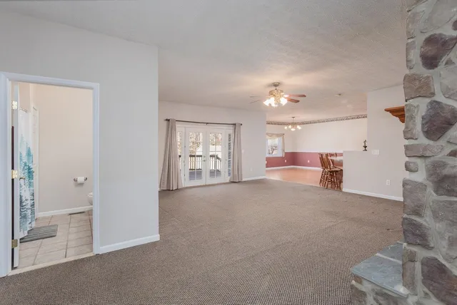 a view of a livingroom with furniture and a fireplace