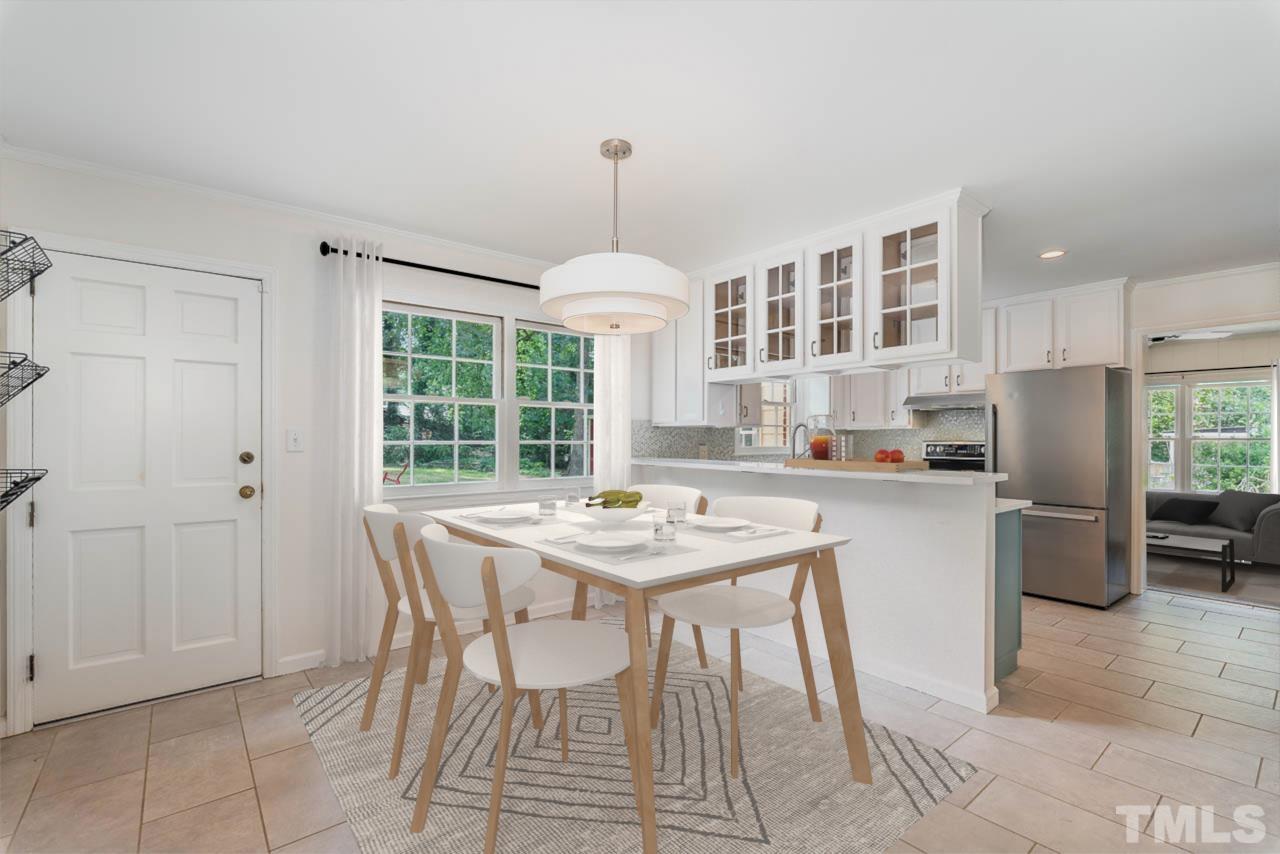 3406 Forest Road Raleigh, NC 27604 - Photo 11 of 31 a kitchen with a table and chairs