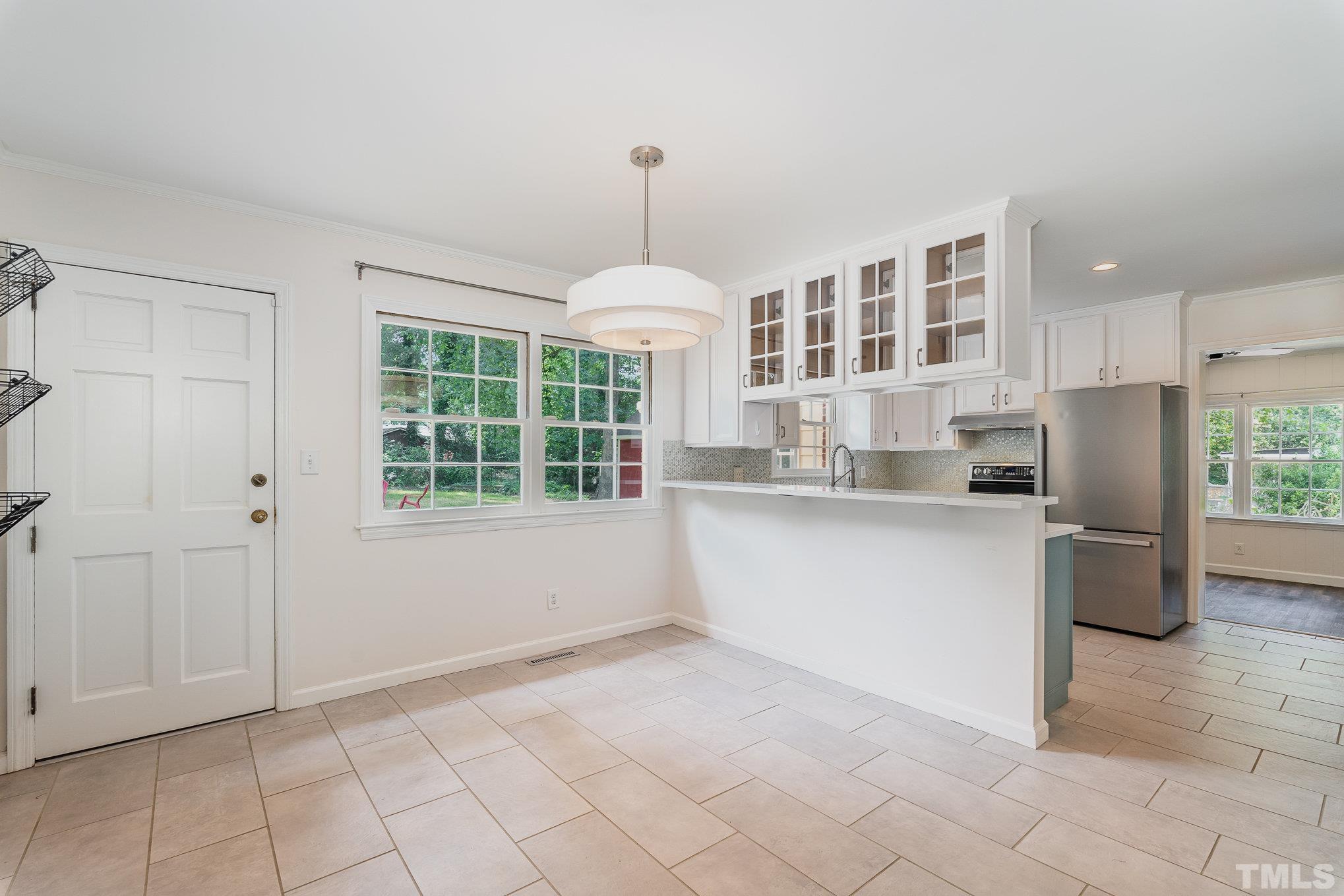 3406 Forest Road Raleigh, NC 27604 - Photo 12 of 31 a view of kitchen with windows