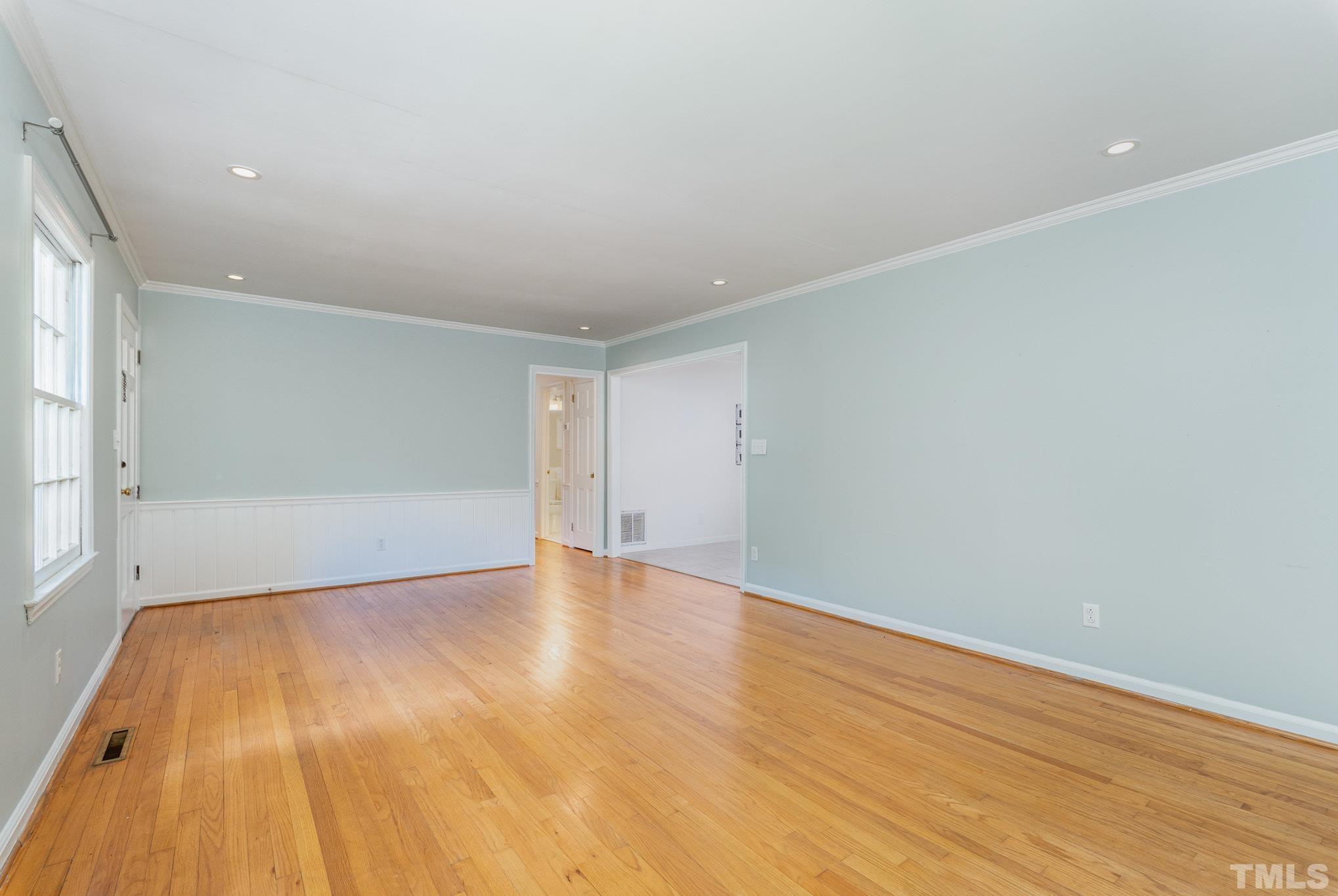 3406 Forest Road Raleigh, NC 27604 - Photo 17 of 31 an empty room with wooden floor and windows
