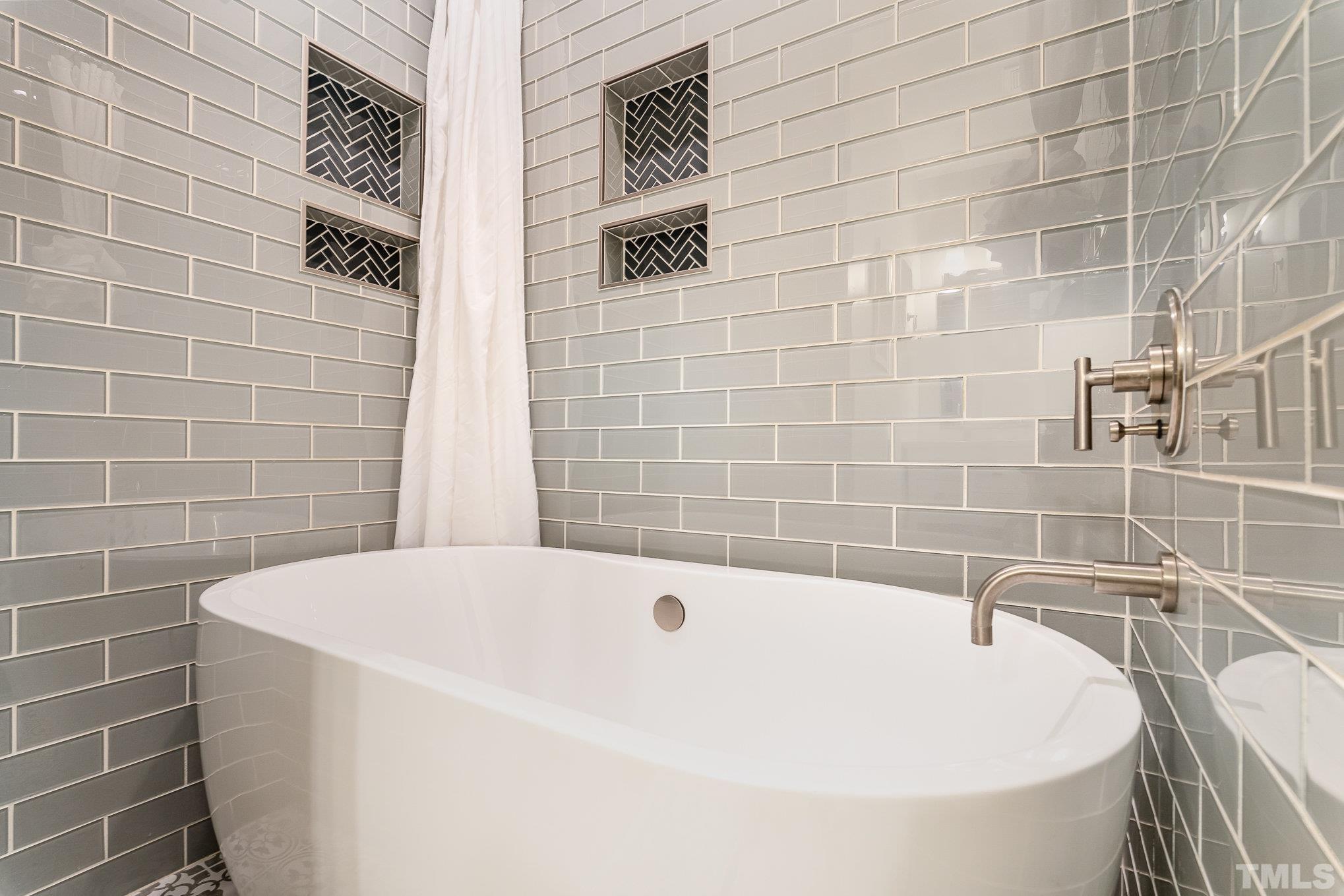 3406 Forest Road Raleigh, NC 27604 - Photo 20 of 31 a white bath tub sitting in a bathroom