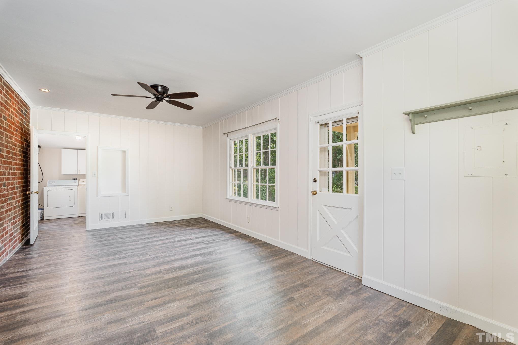 3406 Forest Road Raleigh, NC 27604 - Photo 24 of 31 a view of an empty room with a window and wooden floor