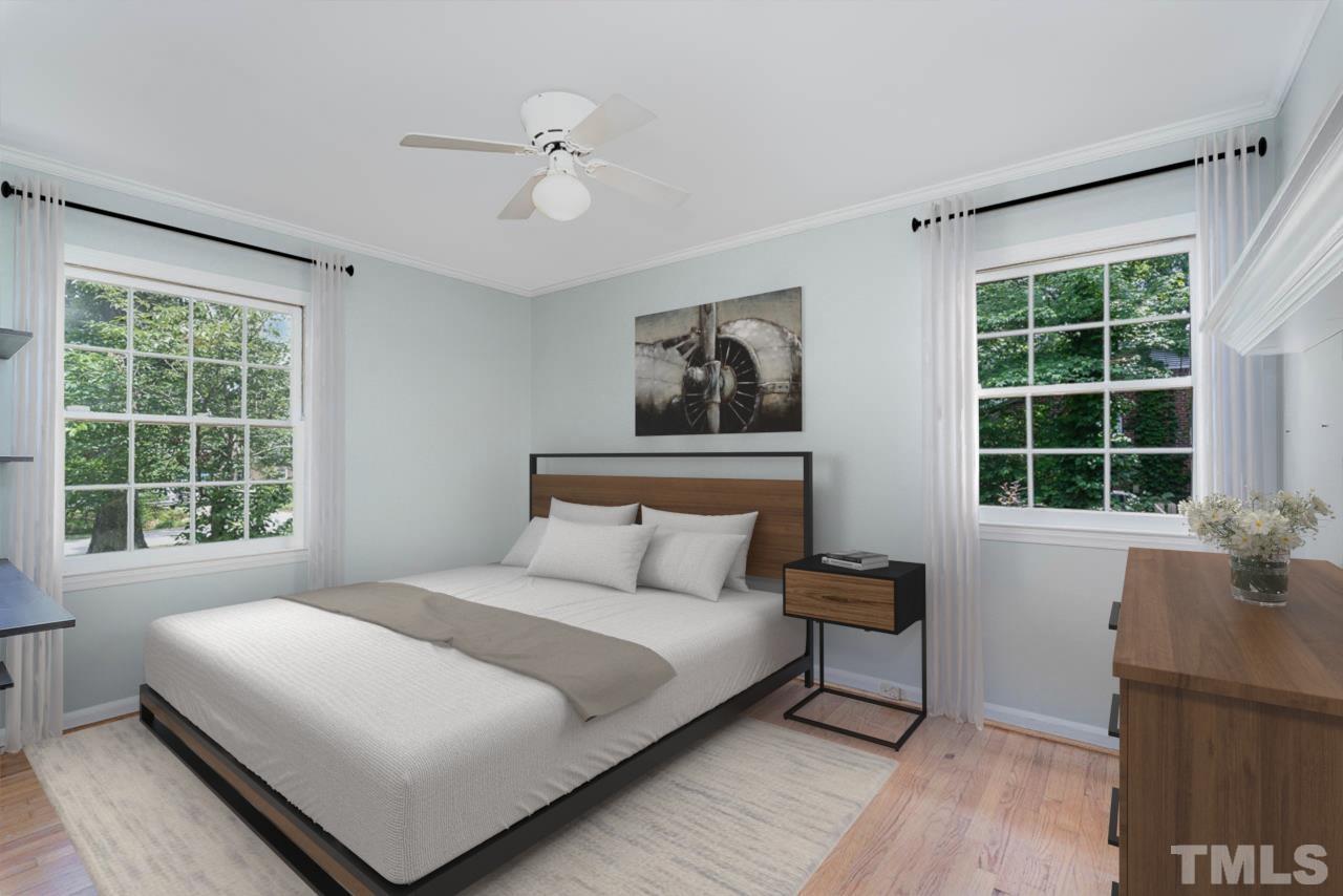 3406 Forest Road Raleigh, NC 27604 - Photo 27 of 31 a bedroom with a large bed and a window