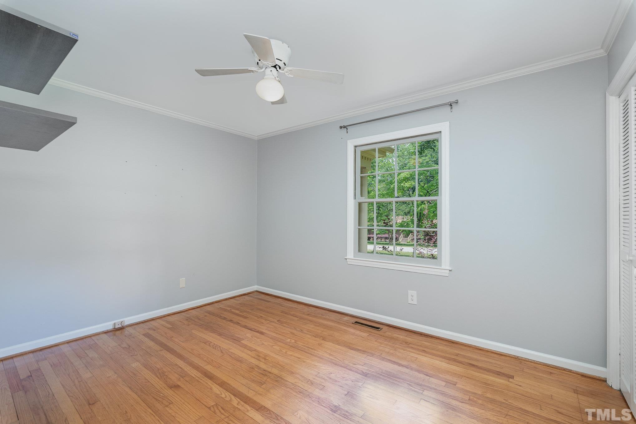 3406 Forest Road Raleigh, NC 27604 - Photo 29 of 31 a view of an empty room with wooden floor and a window