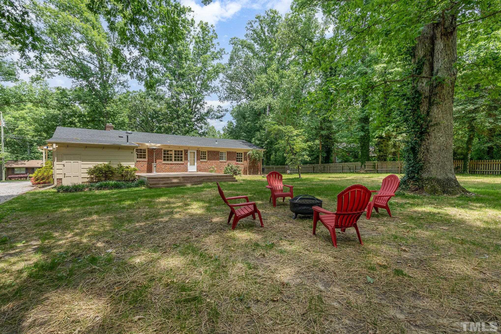 3406 Forest Road Raleigh, NC 27604 - Photo 5 of 31 a backyard of a house with outdoor seating