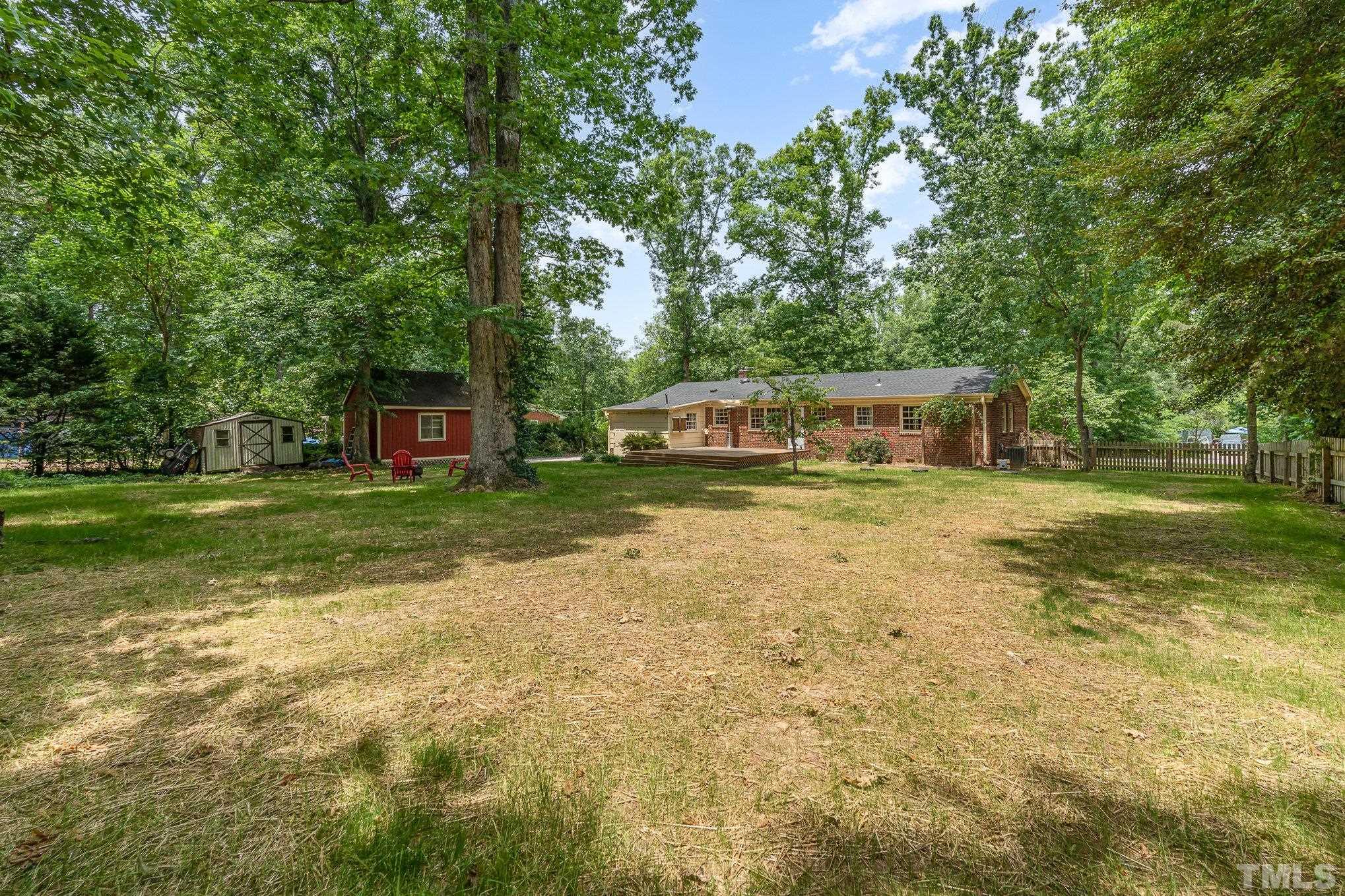 3406 Forest Road Raleigh, NC 27604 - Photo 7 of 31 a view of a house with a yard