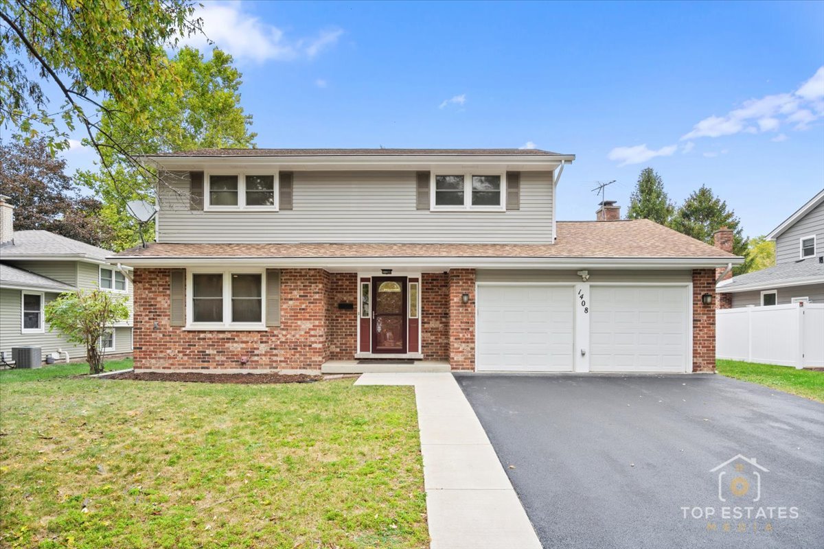 1408 Swallow Street Naperville, IL 60565 - Photo 1 of 54 a front view of house with yard