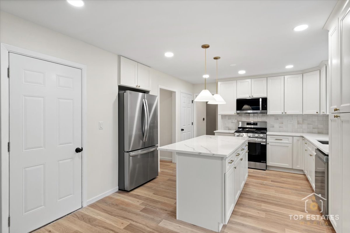 1408 Swallow Street Naperville, IL 60565 - Photo 14 of 54 a kitchen with stainless steel appliances granite countertop a refrigerator stove and oven