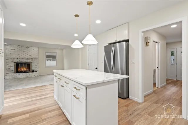 an empty room with a fireplace and window
