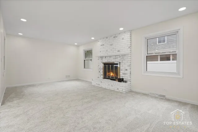 a view of an empty room with a stove