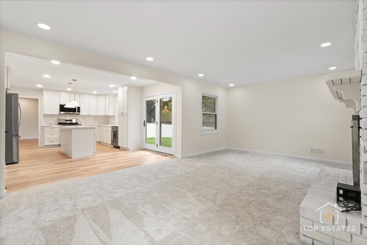 1408 Swallow Street Naperville, IL 60565 - Photo 18 of 54 a view of an empty room with a stove