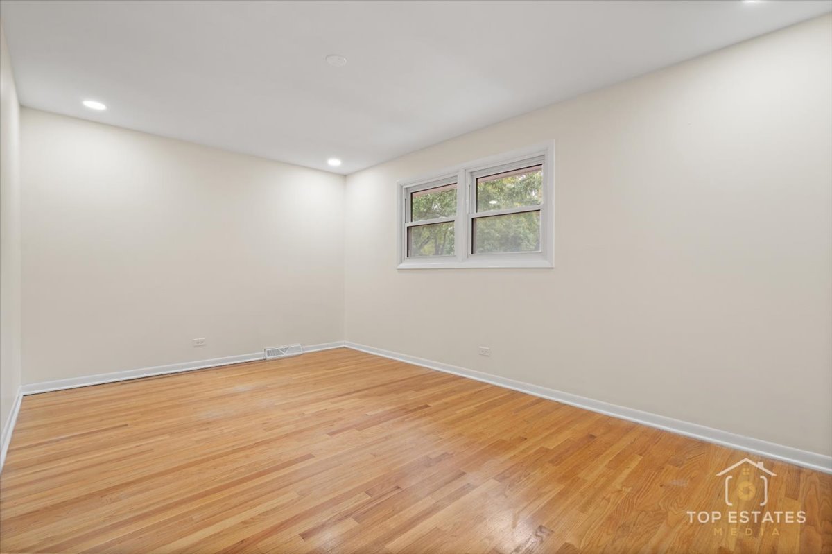 1408 Swallow Street Naperville, IL 60565 - Photo 24 of 54 an empty room with a workbench