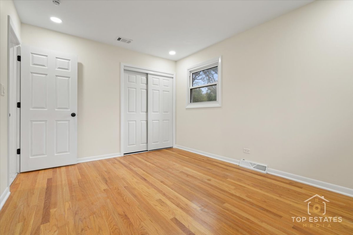 1408 Swallow Street Naperville, IL 60565 - Photo 27 of 54 a view of empty room with wooden floor