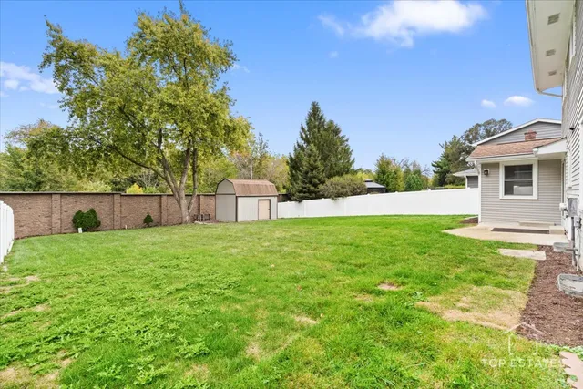 a backyard of a house with lots of green space