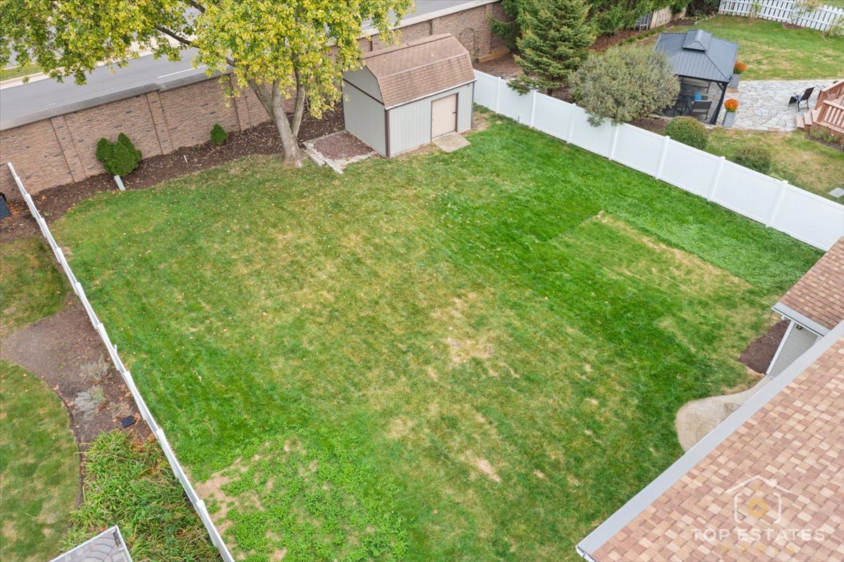 1408 Swallow Street Naperville, IL 60565 - Photo 39 of 54 a backyard of a house with lots of green space