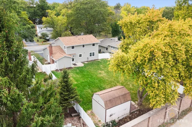 an aerial view of residential house with outdoor space