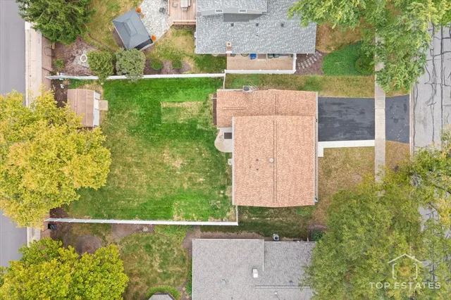 view of a city with lush green forest