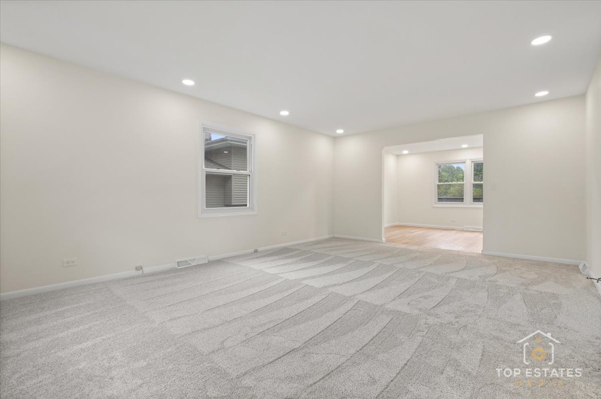 1408 Swallow Street Naperville, IL 60565 - Photo 6 of 54 a view of an empty room with a window