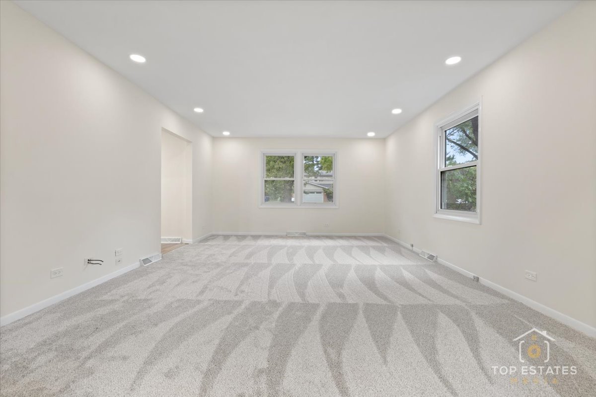 1408 Swallow Street Naperville, IL 60565 - Photo 7 of 54 a view of an empty room with a window