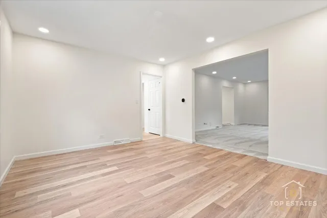 a large kitchen with a stove and a sink