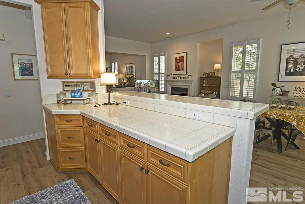 1830 Hunter Creek Road Reno, NV 89519 - Photo 13 of 31 a kitchen with stainless steel appliances a stove a sink cabinets and a table