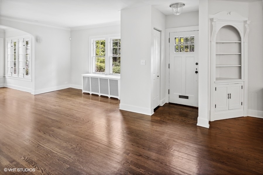 152 Bertling Lane Winnetka, IL 60093 - Photo 12 of 38 an empty room with wooden floor and windows