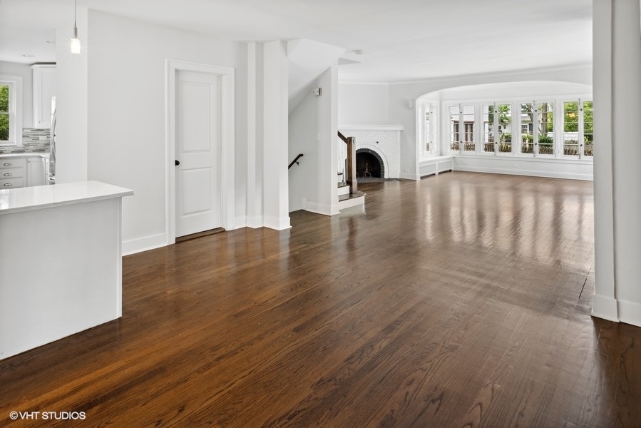 152 Bertling Lane Winnetka, IL 60093 - Photo 14 of 38 a view of empty room with wooden floor and fan