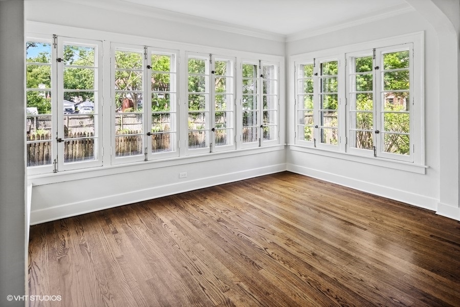 152 Bertling Lane Winnetka, IL 60093 - Photo 15 of 38 a view of an empty room with wooden floor and a window