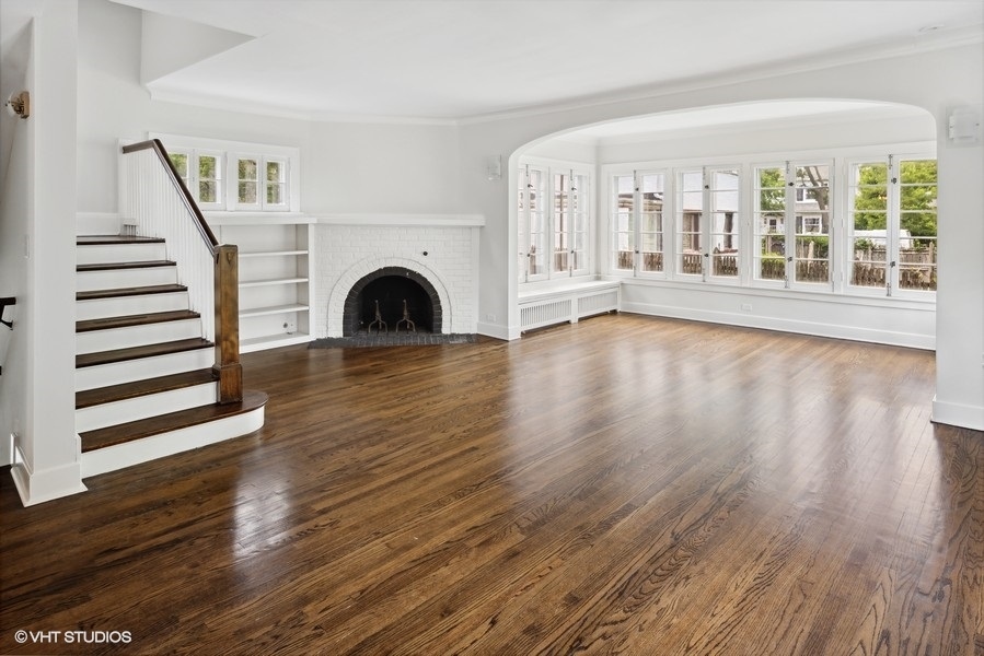 152 Bertling Lane Winnetka, IL 60093 - Photo 10 of 38 a view of an empty room with wooden floor and a window