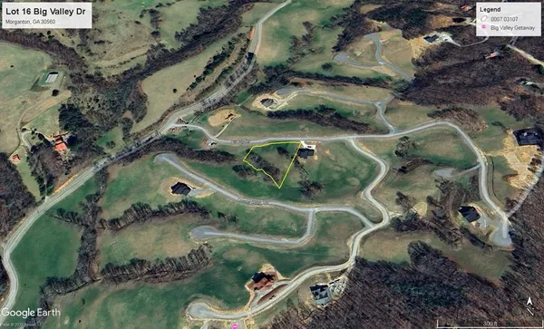 an aerial view of a house with outdoor space