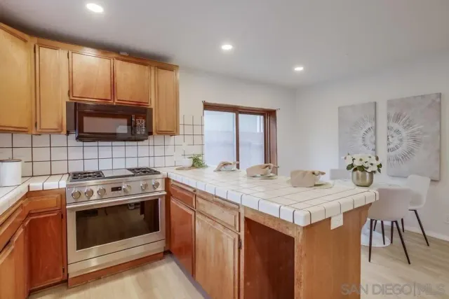 a kitchen with a stove and a sink