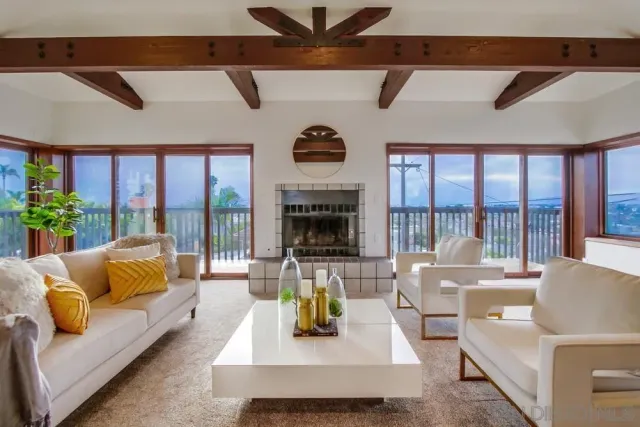 a living room with furniture fireplace and flat screen tv