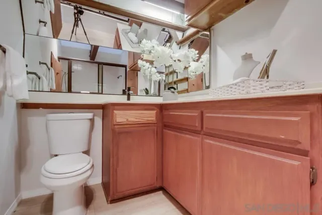 a en suite bathroom with a tub shower and bedroom view