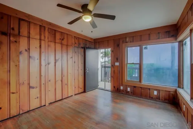 a very nice looking entryway with wooden floor