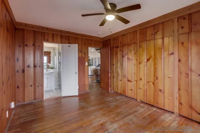 a view of a balcony with wooden fence