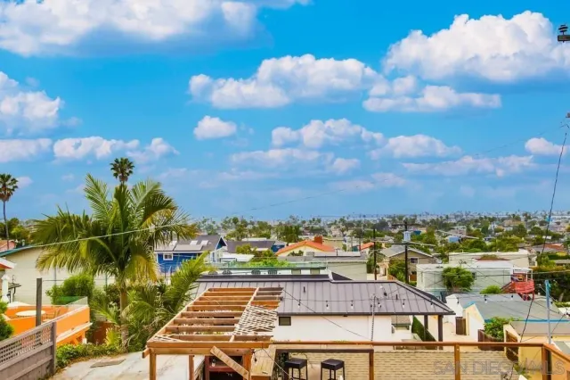 a balcony with table and chairs