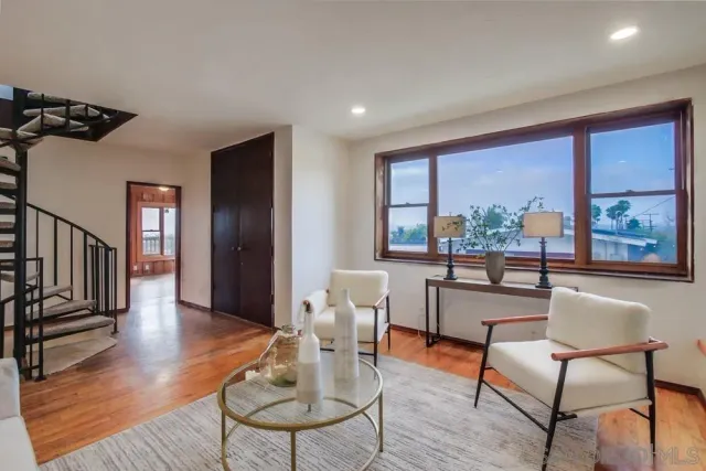 a dining room with furniture window wooden floor