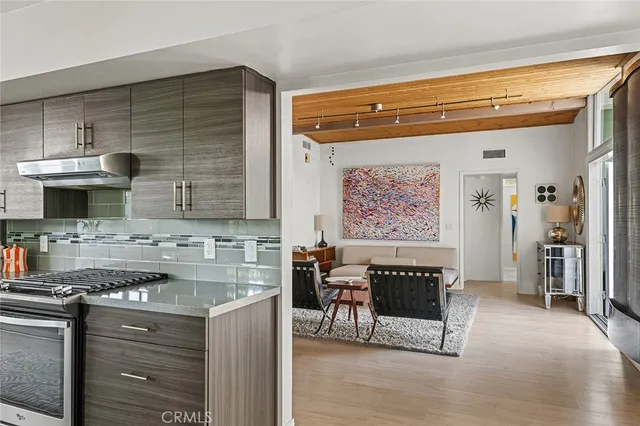 a kitchen with a stove and a refrigerator