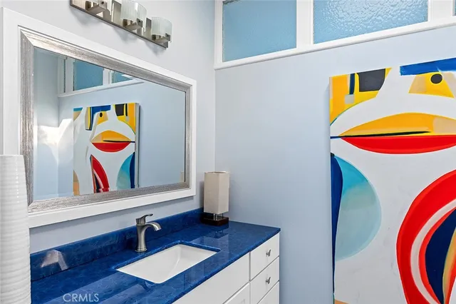 a room with painting and wooden floor