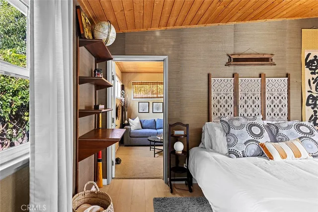 a living room with furniture a rug and a window