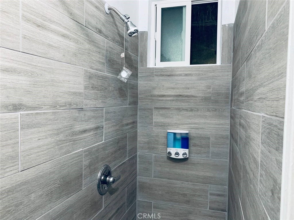 15133 Bellflower Boulevard Bellflower, CA 90706 - Photo 16 of 16 a bathroom with a shower